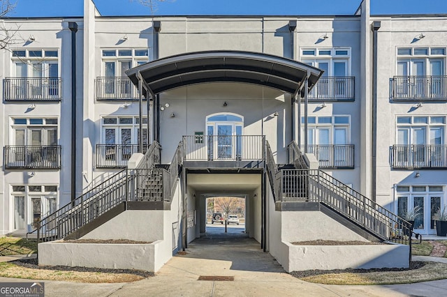 entrance to property featuring stucco siding