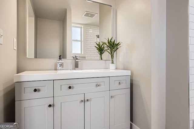 bathroom with visible vents and vanity