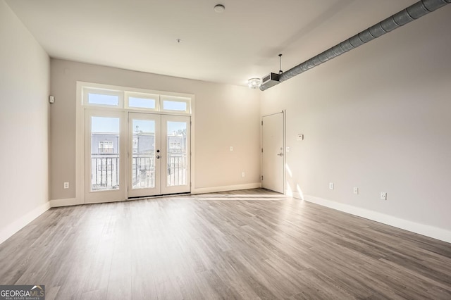 interior space featuring baseboards and wood finished floors