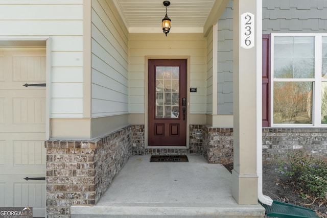 236 Village Park Dr, Newnan, GA 30265 - view of exterior entry with covered porch and stone siding