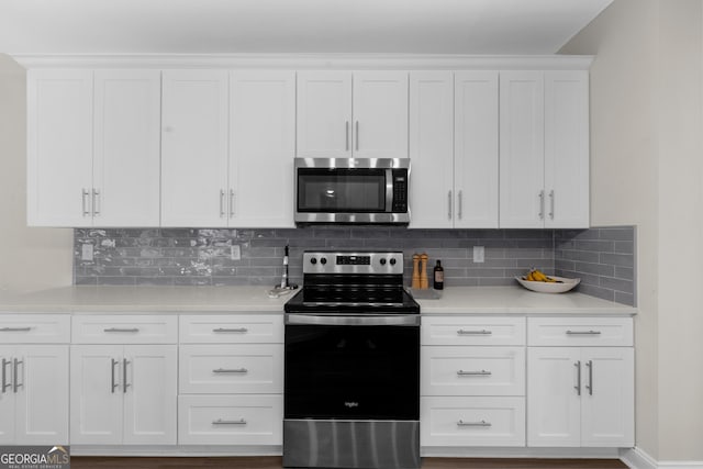 236 Village Park Dr, Newnan, GA 30265 - kitchen featuring stainless steel appliances, light countertops, white cabinets, and backsplash