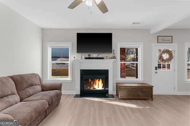 236 Village Park Dr, Newnan, GA 30265 - living area with wood finished floors, a fireplace with flush hearth, ceiling fan, baseboards, and beamed ceiling