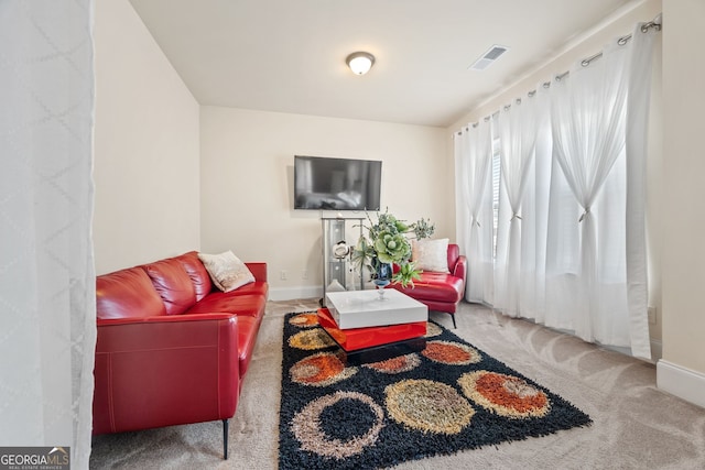 2441 Noelle Ln, Powder Springs, GA 30127 - carpeted living room featuring visible vents and baseboards