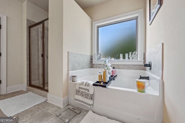 2441 Noelle Ln, Powder Springs, GA 30127 - bathroom with a bath, tile patterned floors, a stall shower, and baseboards
