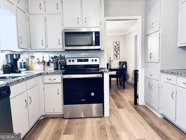 4436 Old Country Way, Snellville, GA 30039 - kitchen with appliances with stainless steel finishes, crown molding, white cabinets, light wood finished floors, and tasteful backsplash