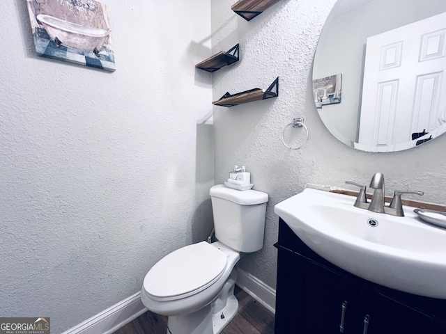 4436 Old Country Way, Snellville, GA 30039 - half bathroom featuring vanity, wood finished floors, and a textured wall