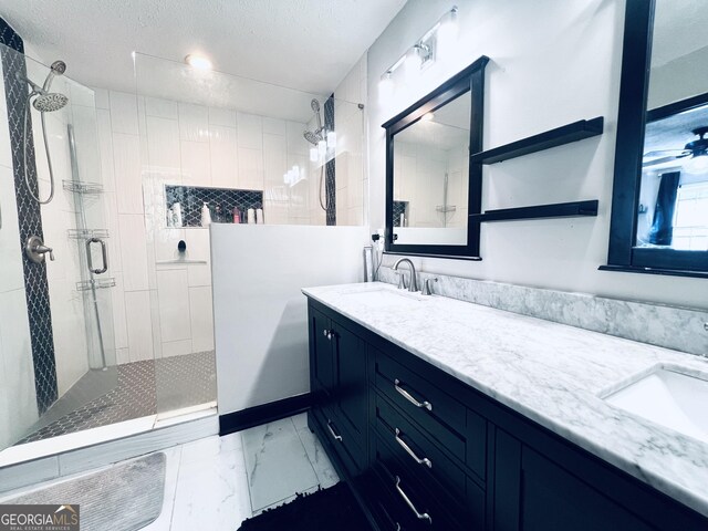 4436 Old Country Way, Snellville, GA 30039 - bathroom with a walk in shower, marble look tile flooring, double vanity, and a textured ceiling