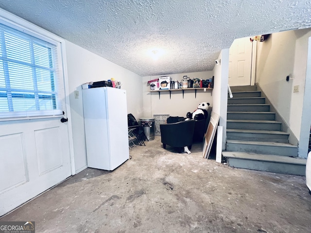 4436 Old Country Way, Snellville, GA 30039 - basement with a textured ceiling, stairway, and freestanding refrigerator