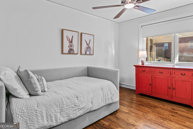 bedroom featuring ceiling fan and wood finished floors