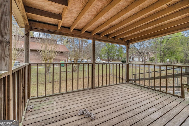 wooden deck with a yard