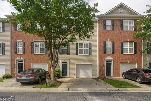 5381 Briar Creek Ln, Norcross, GA 30071 - multi unit property with driveway, a garage, and brick siding