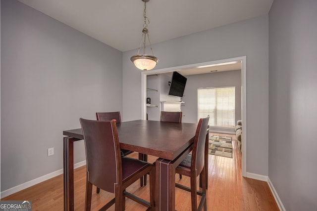 5381 Briar Creek Ln, Norcross, GA 30071 - dining area with light wood-style flooring and baseboards