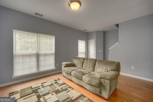 5381 Briar Creek Ln, Norcross, GA 30071 - living room featuring baseboards, healthy amount of natural light, and wood finished floors