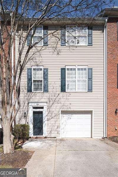 5381 Briar Creek Ln, Norcross, GA 30071 - view of property featuring concrete driveway and an attached garage