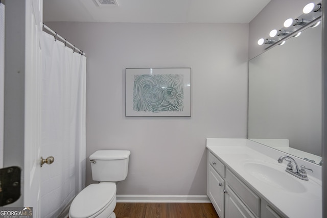 5381 Briar Creek Ln, Norcross, GA 30071 - bathroom with wood finished floors, toilet, vanity, and baseboards
