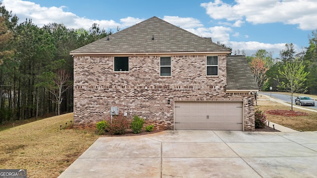 view of side of home with driveway, a garage, brick siding, a lawn, and a shingled roof