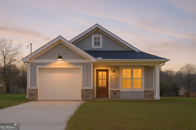 149 Irwin St, Cedartown, GA 30125 - craftsman-style home featuring stone siding, a front lawn, concrete driveway, board and batten siding, and a garage