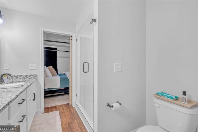 149 Irwin St, Cedartown, GA 30125 - bathroom featuring wood finished floors, vanity, a shower stall, and toilet