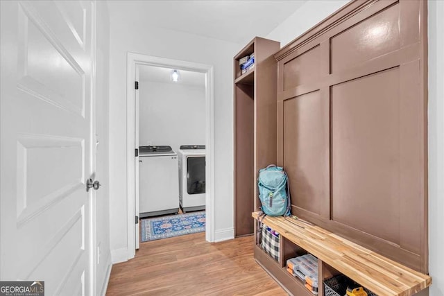 149 Irwin St, Cedartown, GA 30125 - mudroom featuring washer and clothes dryer, light wood finished floors, and baseboards