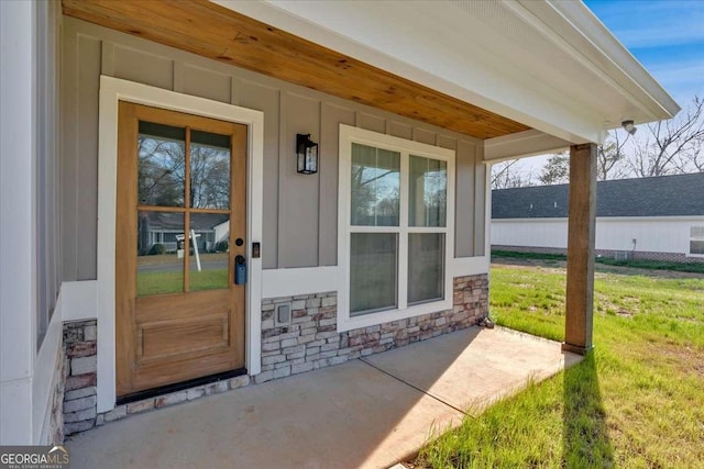 149 Irwin St, Cedartown, GA 30125 - entrance to property featuring covered porch, stone siding, and a yard
