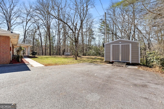 3920 Blue Ridge Dr, Blue Ridge, GA 30513 - view of yard with a storage unit and an outdoor structure
