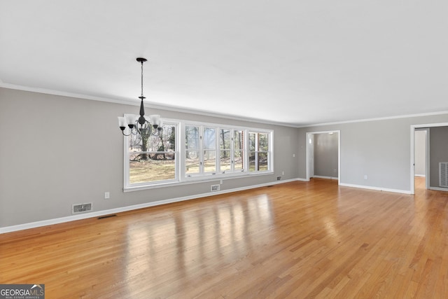 3920 Blue Ridge Dr, Blue Ridge, GA 30513 - unfurnished living room featuring light wood-style flooring, visible vents, baseboards, and a chandelier