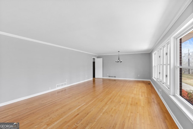 3920 Blue Ridge Dr, Blue Ridge, GA 30513 - interior space with baseboards, visible vents, light wood-style flooring, ornamental molding, and a chandelier