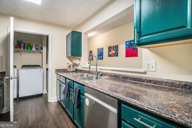 kitchen with a sink, washing machine and clothes dryer, dishwasher, dark wood-style floors, and dark countertops
