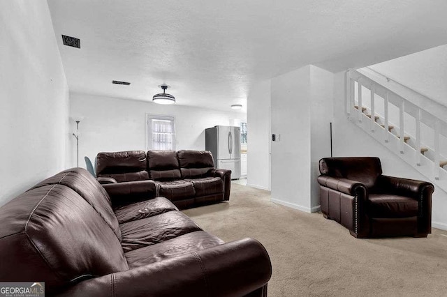 4663 Hairston Crossing Pl, Stone Mountain, GA 30083 - living area with light colored carpet, baseboards, stairs, and visible vents