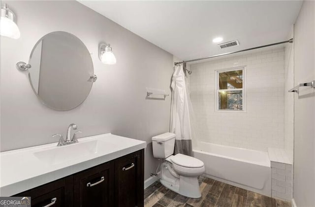 3672 Howell Wood Trl NW, Duluth, GA 30096 - full bath featuring vanity, visible vents, wood tiled floor, shower / tub combo, and toilet