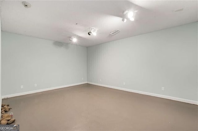3672 Howell Wood Trl NW, Duluth, GA 30096 - spare room featuring visible vents, finished concrete flooring, and baseboards