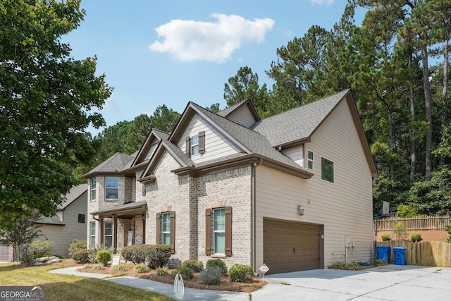 craftsman-style house with brick siding and a front lawn