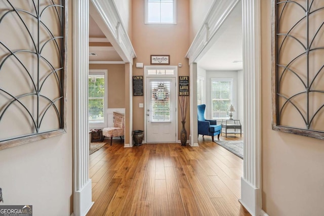 entryway featuring baseboards and hardwood / wood-style floors