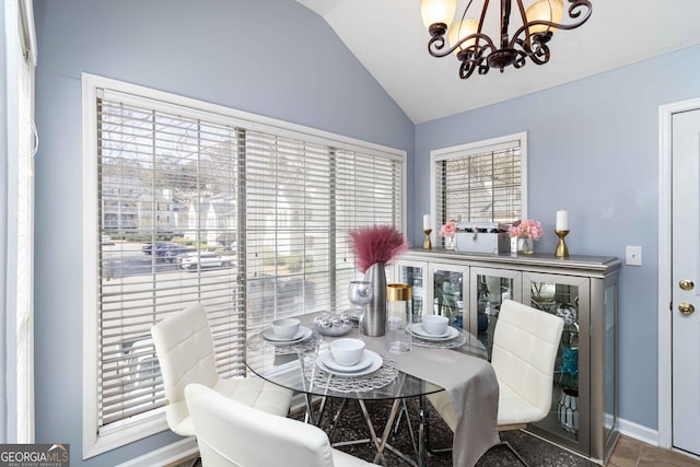 909 Glenleaf Dr, Peachtree Corners, GA 30092 - dining room featuring a chandelier, lofted ceiling, and baseboards