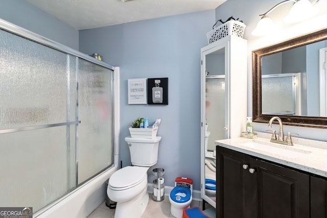 909 Glenleaf Dr, Peachtree Corners, GA 30092 - bathroom featuring toilet, tile patterned floors, vanity, and enclosed tub / shower combo
