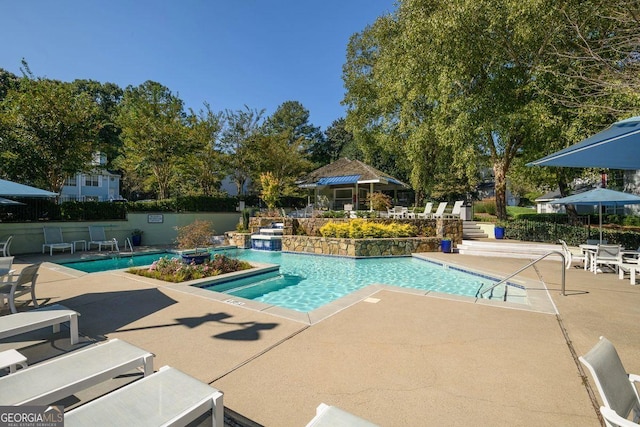 909 Glenleaf Dr, Peachtree Corners, GA 30092 - community pool featuring a patio and view of wooded area