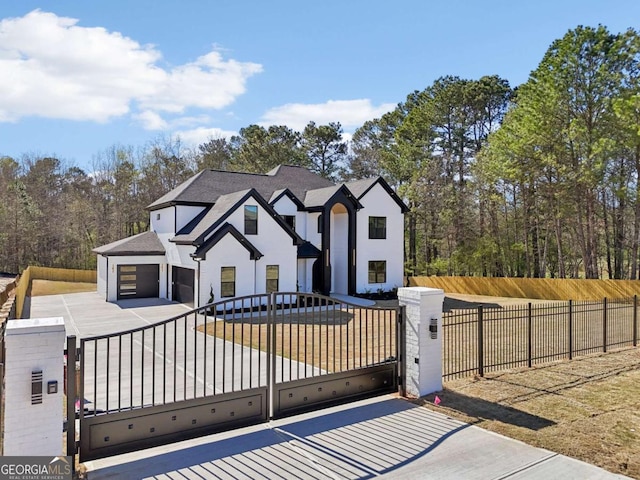 3057 Bold Springs Rd, Dacula, GA 30019 - view of front of property featuring a fenced front yard, stucco siding, driveway, and a gate