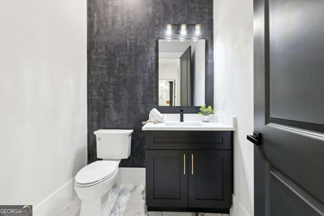 3057 Bold Springs Rd, Dacula, GA 30019 - bathroom with vanity, toilet, and marble finish floor