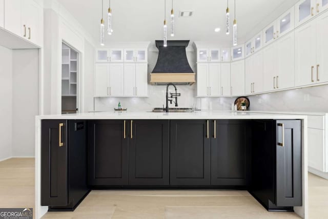 3057 Bold Springs Rd, Dacula, GA 30019 - kitchen featuring visible vents, premium range hood, light countertops, white cabinets, and decorative light fixtures
