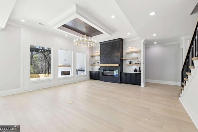 3057 Bold Springs Rd, Dacula, GA 30019 - unfurnished living room with a chandelier, ornamental molding, stairway, light wood-style flooring, and recessed lighting