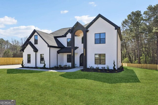3057 Bold Springs Rd, Dacula, GA 30019 - modern inspired farmhouse with stucco siding, a front lawn, and fence