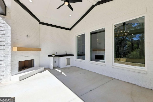 3057 Bold Springs Rd, Dacula, GA 30019 - view of patio / terrace with a ceiling fan and an outdoor brick fireplace