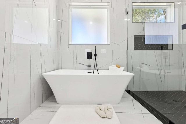 3057 Bold Springs Rd, Dacula, GA 30019 - bathroom featuring a marble finish shower and a freestanding bath