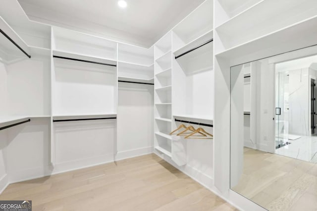 3057 Bold Springs Rd, Dacula, GA 30019 - spacious closet with light wood finished floors