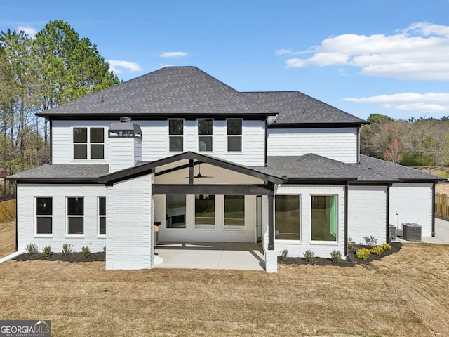 3057 Bold Springs Rd, Dacula, GA 30019 - rear view of house featuring a patio area, brick siding, and roof with shingles