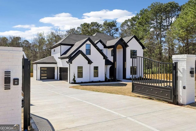 3057 Bold Springs Rd, Dacula, GA 30019 - view of front of property featuring a shingled roof, stucco siding, a garage, driveway, and a gate