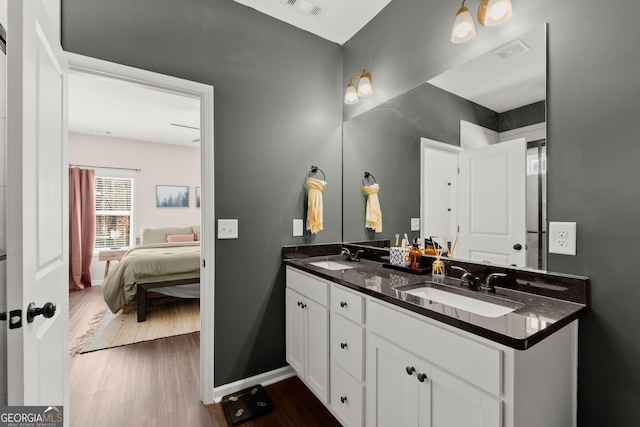 149 Pleasantdale Dr, Demorest, GA 30535 - ensuite bathroom featuring wood finished floors, double vanity, and baseboards