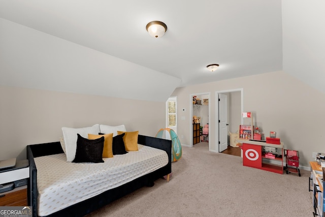 149 Pleasantdale Dr, Demorest, GA 30535 - carpeted bedroom with a spacious closet, vaulted ceiling, and baseboards