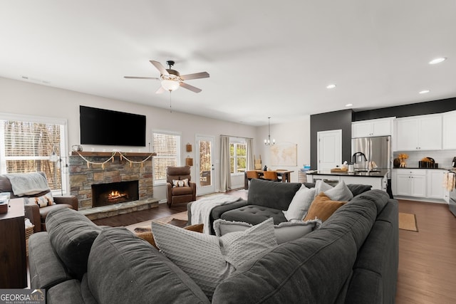 149 Pleasantdale Dr, Demorest, GA 30535 - living area featuring dark wood-style flooring, ceiling fan, a stone fireplace, recessed lighting, and a chandelier