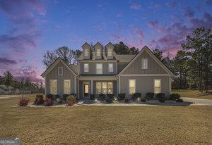 view of front of home with a lawn and board and batten siding